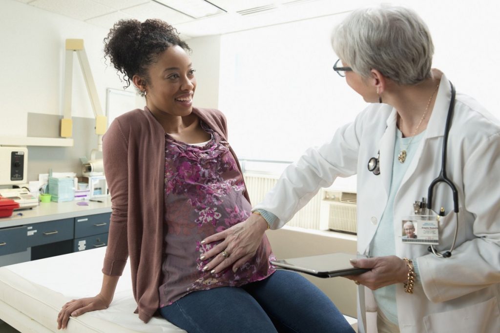 Pregnancy fibroids woman with doctor