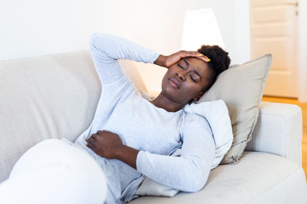 fibroid symptoms woman in pain