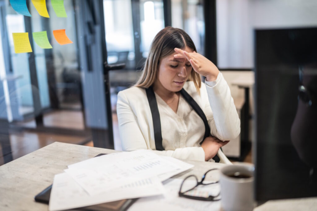 heavy periods worried woman at office
