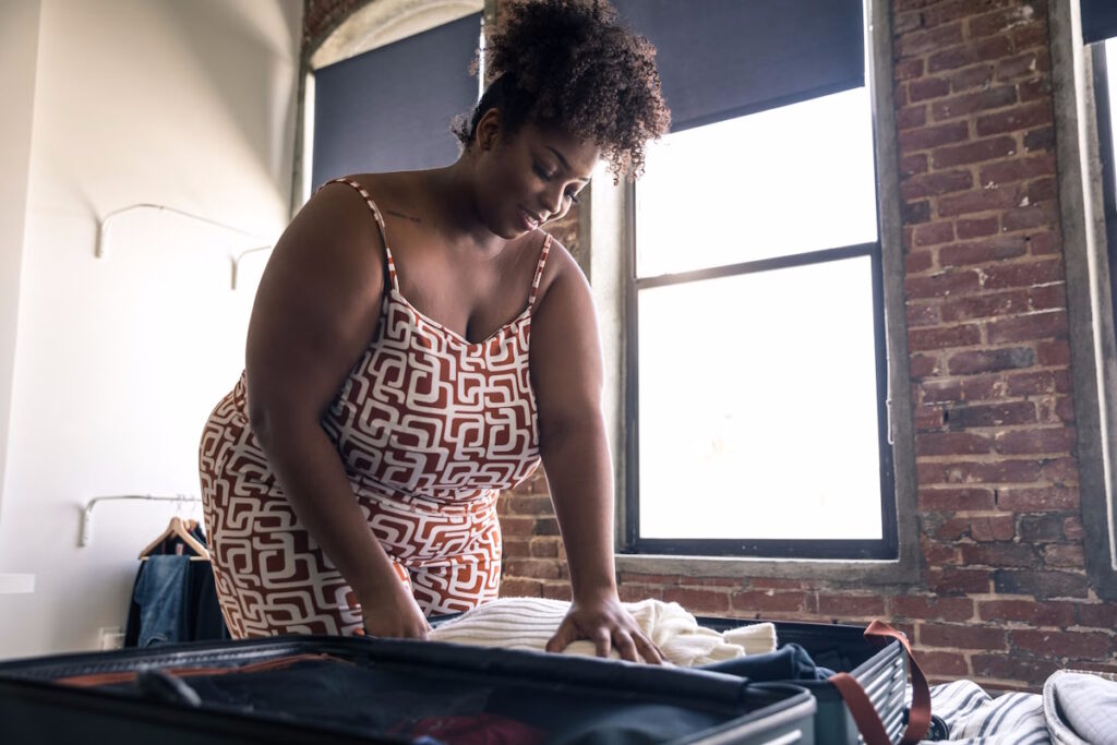 fibroid symptoms on vacation woman packing