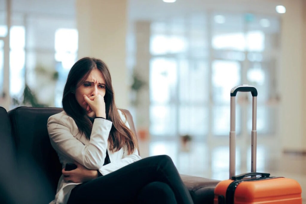 fibroid symptoms on vacation worried woman at airport